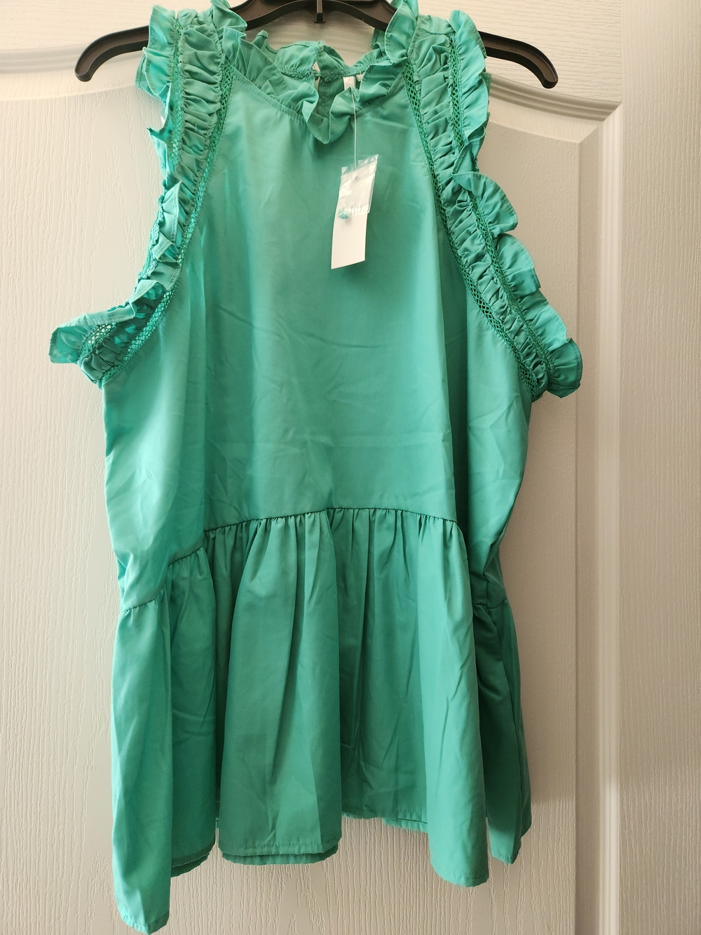 Sleeveless Ruffle Peplum Top in Teal Green